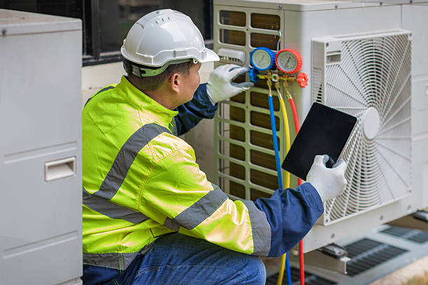 Professional Emergency Hvac Repair technician working in Aquebogue, NY